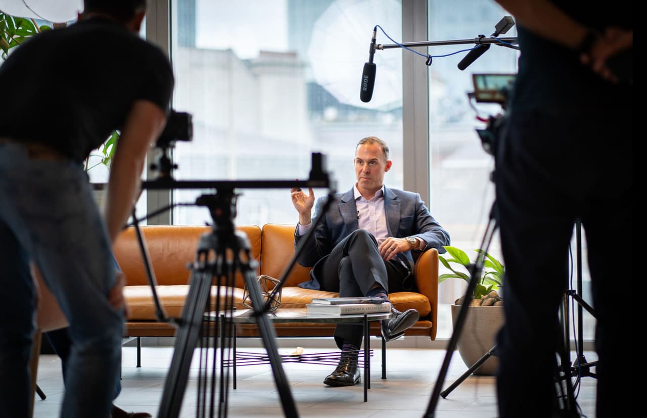 Behind-the-scenes corporate video production filming an interview