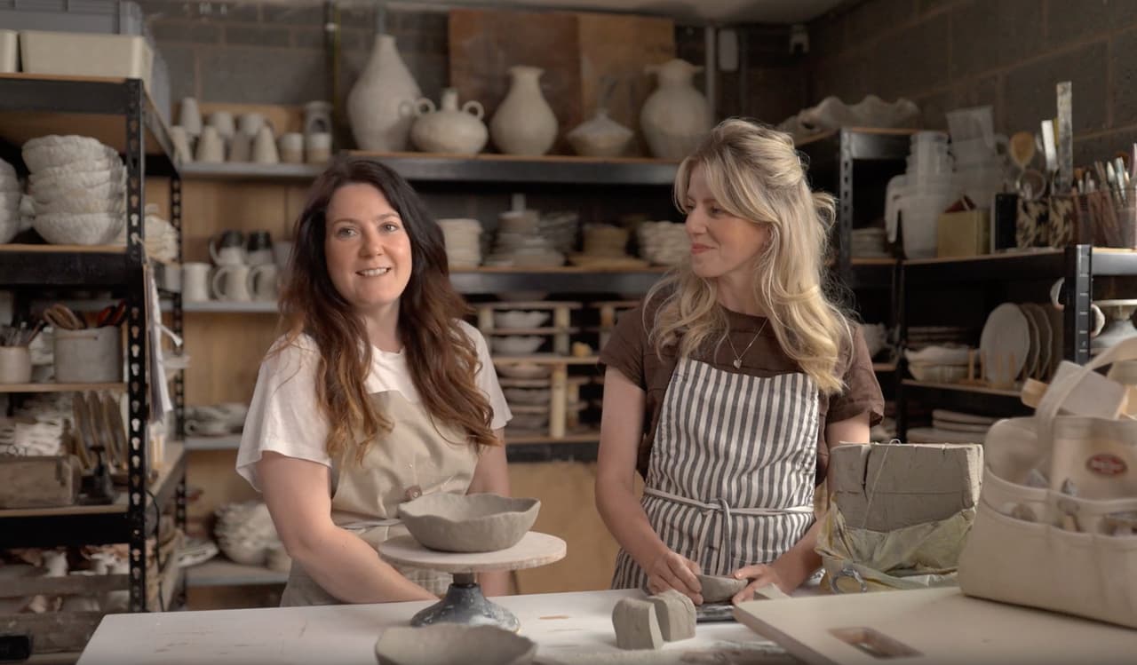 Two people smiling in a human-led Etsy customer and partner story