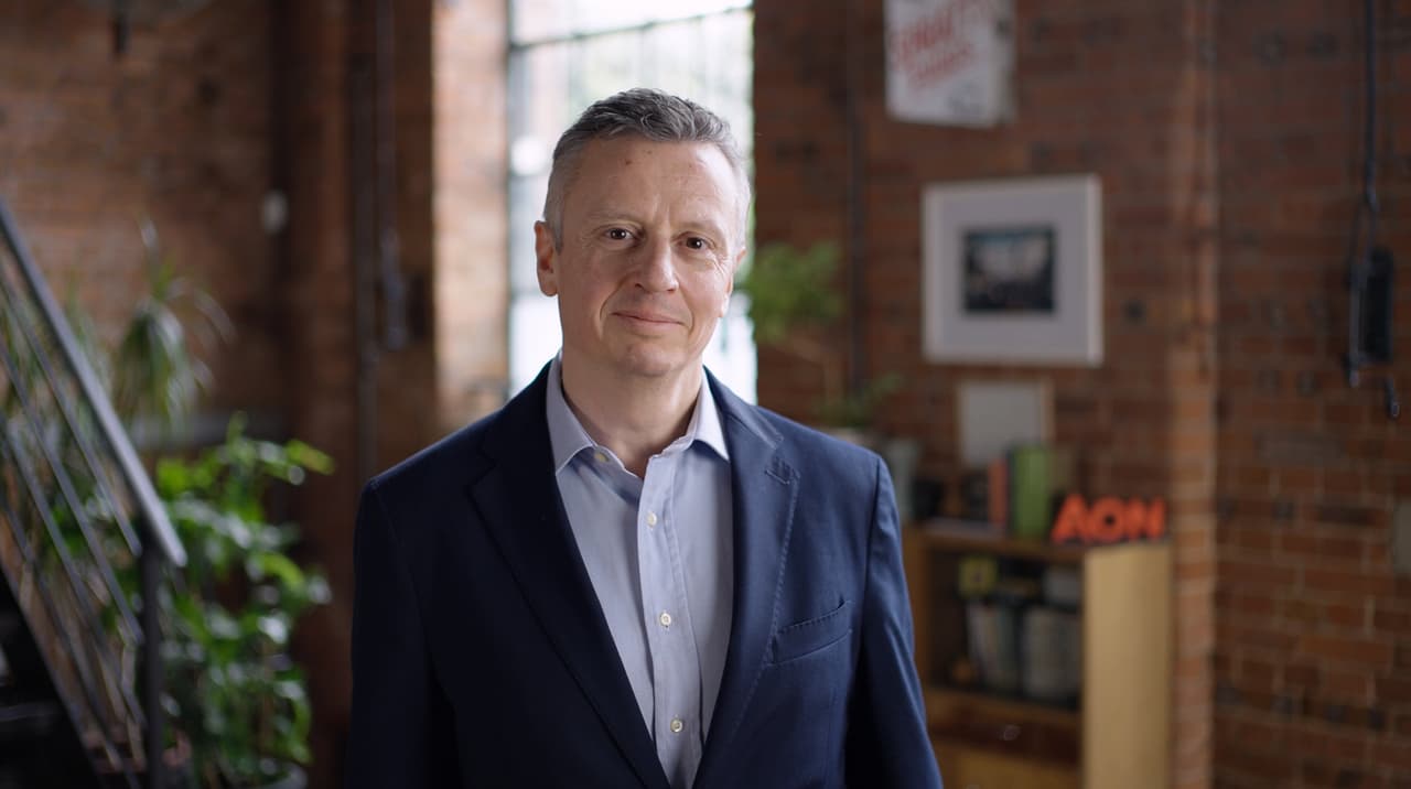 Senior executive smiling during a London studio production