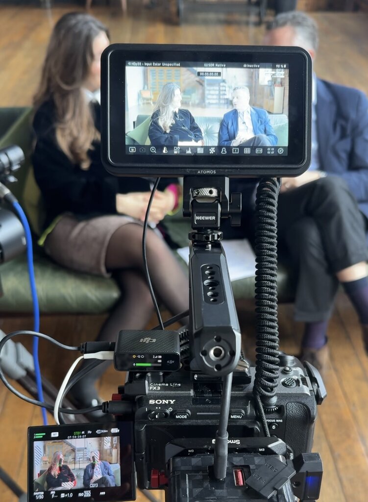 Behind the scenes of a corporate video production featuring two leaders from Aon