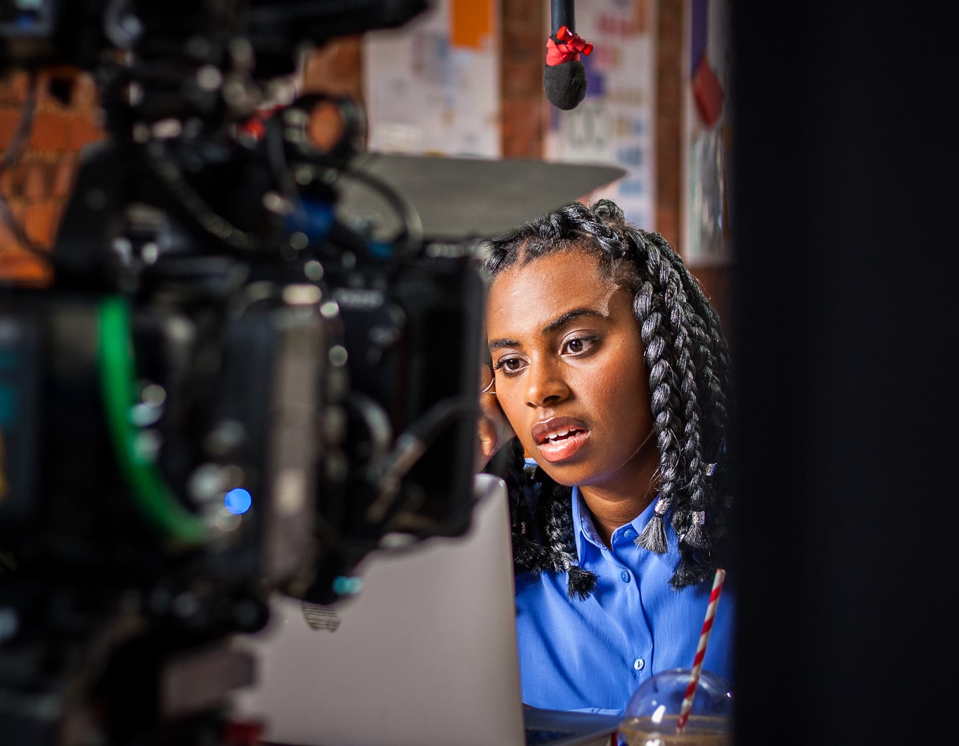 Woman being filmed on set during a creative video production shoot