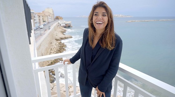 Hospitality partner featured in an Expedia customer story video overlooking the coast in France.