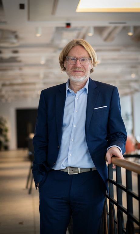 Senior male legal leader posing on a staircase during a corporate photography shoot