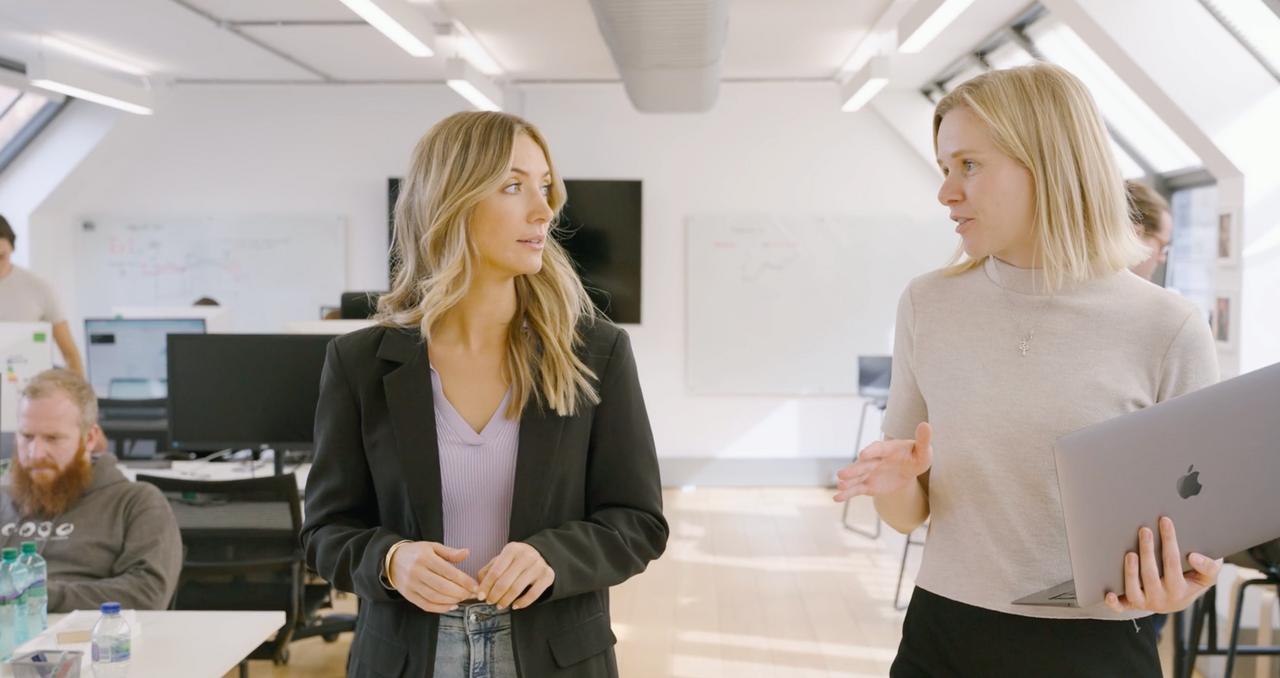 Essentia Analytics team members walking through an office for a Payhawk customer story