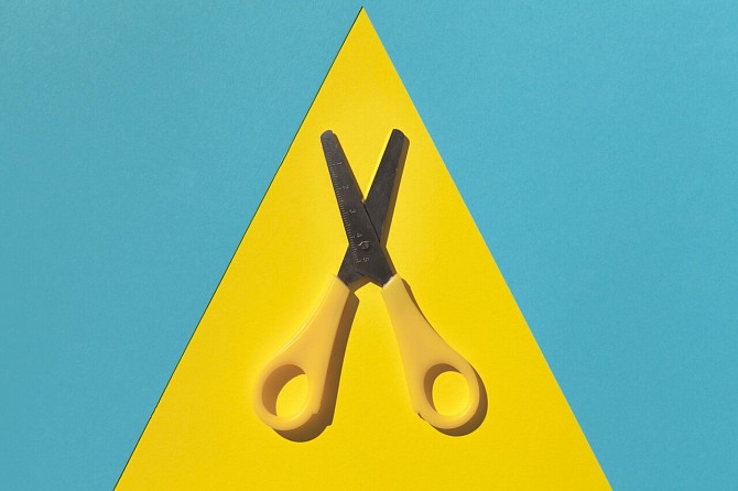 Scissors blue yellow background