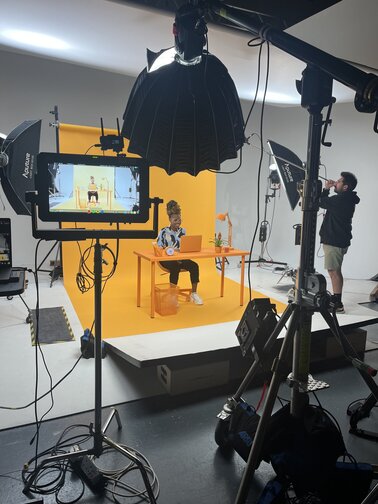 behind the scenes of video shoot in a studio