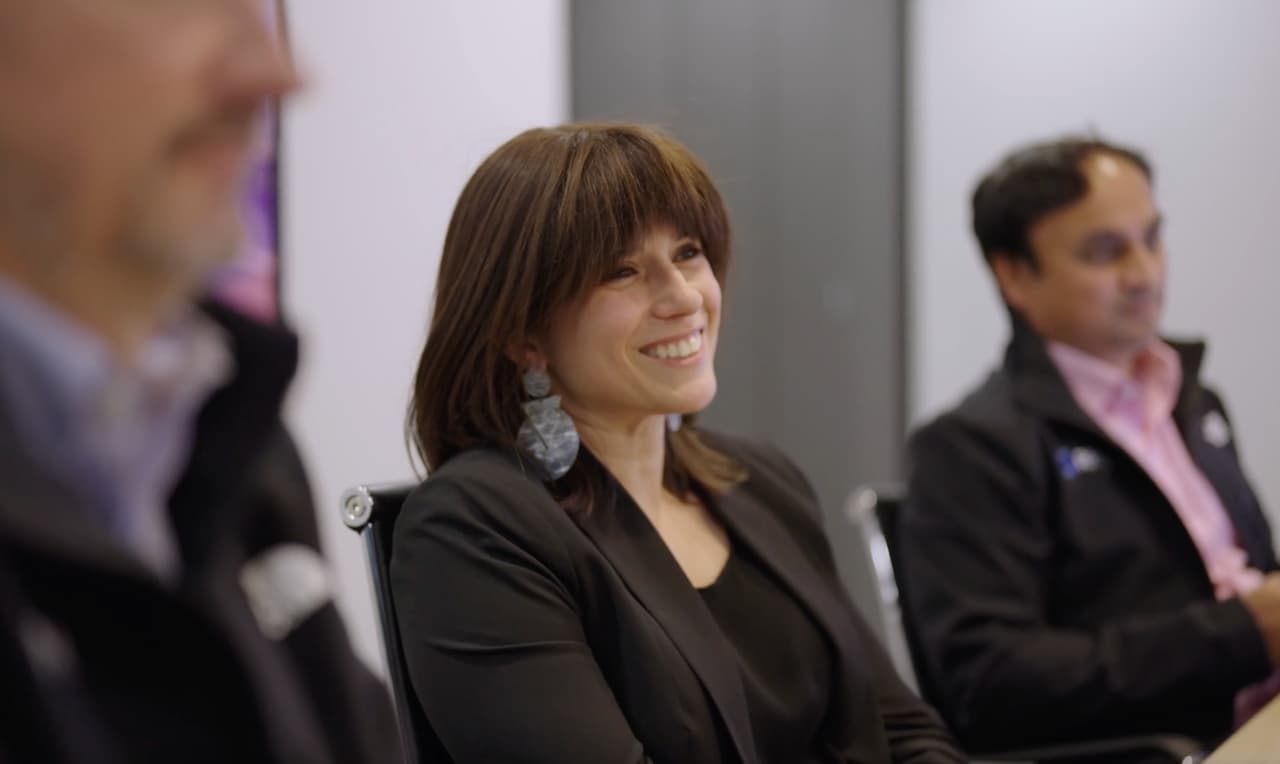 RMS employees together in a boardroom during an employer brand video production
