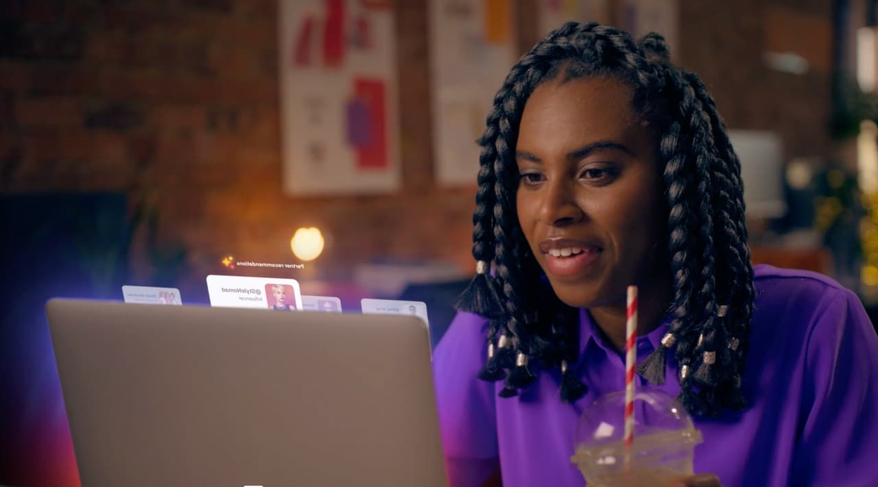 Awin SaaS brand video showing a digital marketer interacting with animated platform UI
