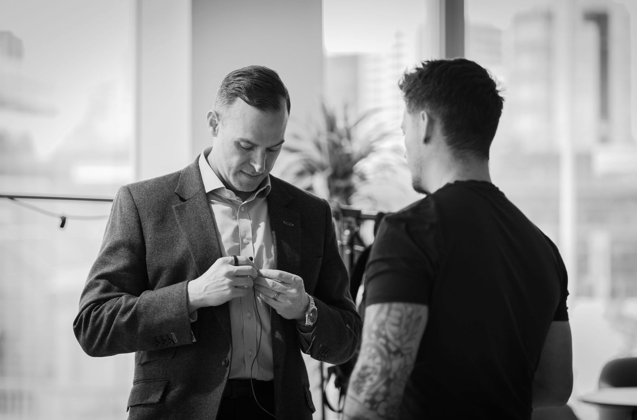 Team member preparing a subject during an employer brand video filming